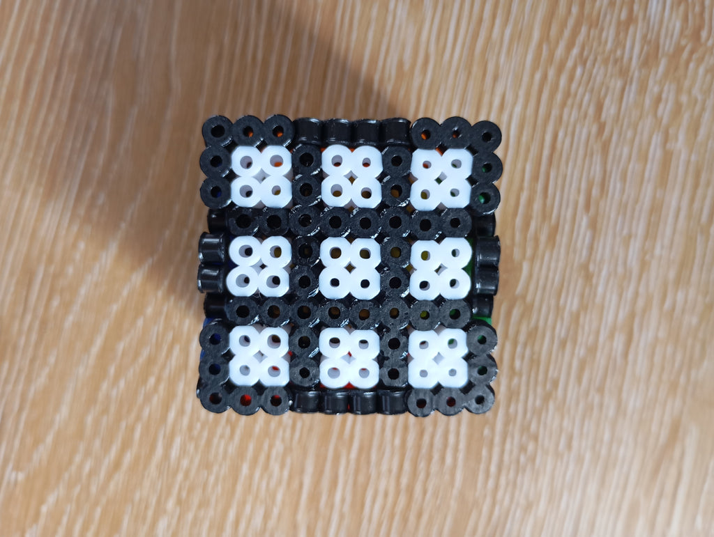 Figurita en 3D de cubo de Rubik